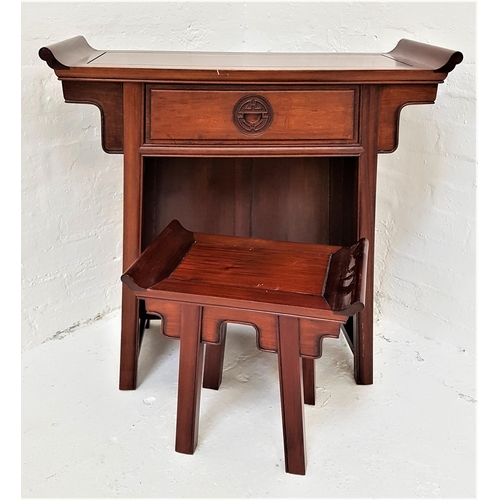 383 - CHINESE HARDWOOD KNEEHOLE TABLE
with a shaped top above a central frieze drawer, standing on panelle... 