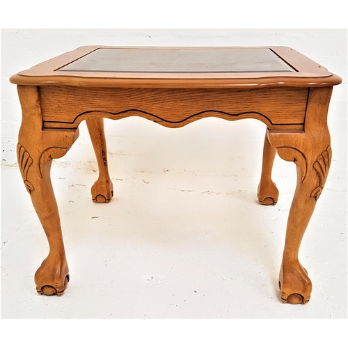 385 - LIGHT OAK OCCASIONAL TABLE
with an inset smoked glass top above a shaped frieze, standing on cabriol... 