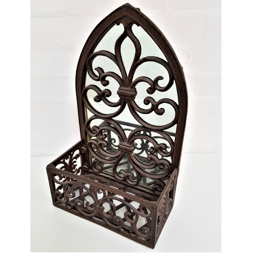 389 - DECORATIVE IRON FRAME WALL MIRROR
of arch design with a fleur de lis pattern and decorative front fa... 