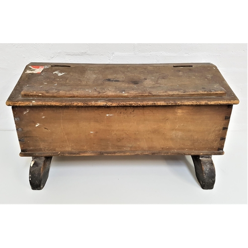 391 - PINE CLERKS TYPE DESK
with a sloping lift up lid, on stout supports, 40cm x 77.5cm