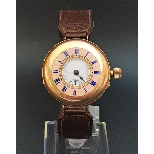 64 - CONTINENTAL TWELVE CARAT GOLD HALF HUNTER WRISTWATCH
the white enamel dial with Roman numerals and s... 