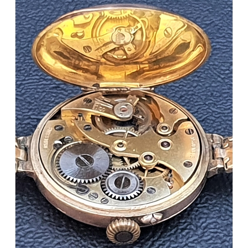 81 - EARLY 20th CENTURY NINE CARAT GOLD CASED WRISTWATCH
the gilt dial with Roman numerals and 15 jewels ... 