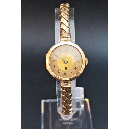 113 - LADIES VINTAGE NINE CARAT GOLD CASED WRISTWATCH
the dial with Roman numerals, on expanding bracelet ... 