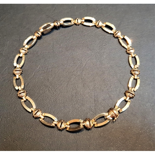 68 - HEAVY NINE CARAT GOLD NECKLACE
with shaped and pierced links, total weight approximately 33.2 grams