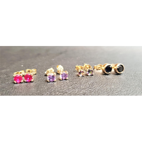 111 - FOUR PAIRS OF GEM SET STUD EARRINGS
all in nine carat gold, comprising mystic topaz, ruby, sapphire ... 
