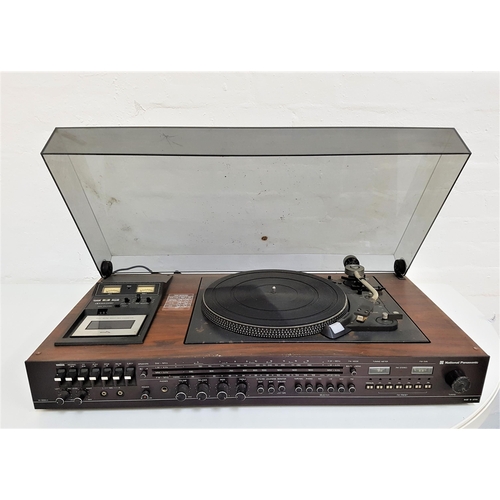 279 - NATIONAL PANASONIC MUSIC CENTRE
with a smoked plastic lift up lid revealing a record player, cassett... 