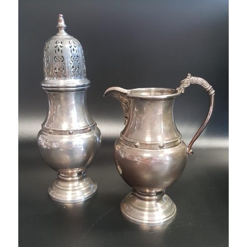 130 - ELIZABETH II SILVER SUGAR CASTER
of baluster form, together with a matching silver cream jug, both B... 