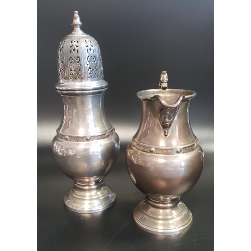 130 - ELIZABETH II SILVER SUGAR CASTER
of baluster form, together with a matching silver cream jug, both B... 