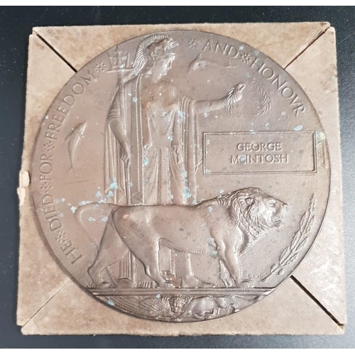 329 - WWI BRONZE MEMORIAL PLAQUE
named to George McIntosh, 12cm diameter, in a card case