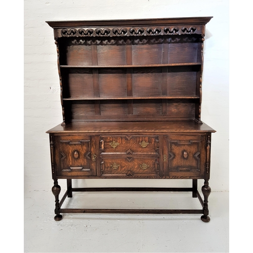 373 - OAK DRESSER
with a plain pediment above a carved and pierced frieze with two shelves below, the base... 