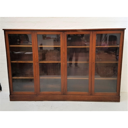 375 - WYLIE & LOCHHEAD SIDE CABINET
with a plain top above two pairs of glazed doors, opening to reveal ad... 