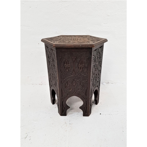 397 - INDIAN HARDWOOD HEXAGONAL OCCASIONAL TABLE
with carved decoration overall and a lift up top revealin... 