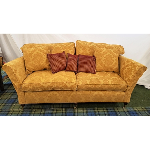 423 - LARGE TWO SEAT SOFA
with a shaped back and scroll arms, with loose back and seat cushions covered in... 