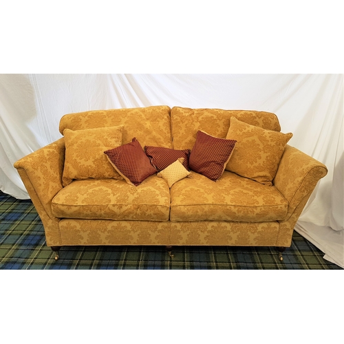 424 - LARGE TWO SEAT SOFA
with a shaped back and scroll arms, with loose back and seat cushions covered in... 