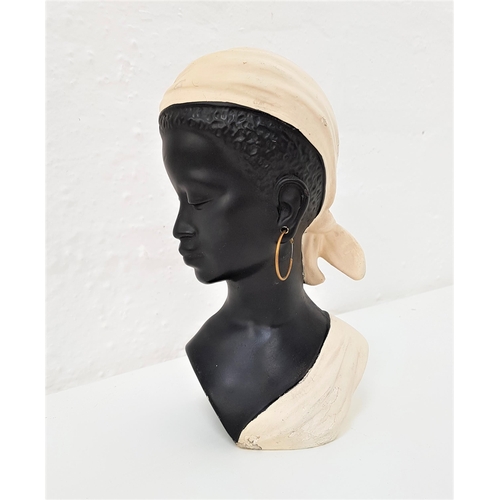 165 - 1950s CHALKWARE PLASTER BUST
the black female bust with white headscarf and draped top, with gilt ea... 