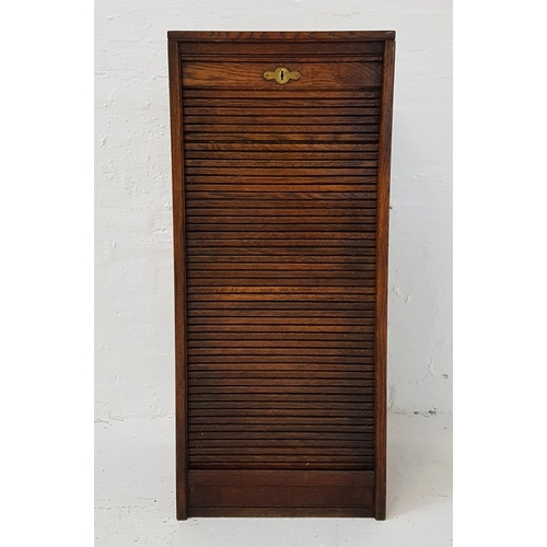 439 - OAK TAMBOUR FRONT CABINET
with a drop down front revealing drawers, standing on a plinth base, 103.5... 