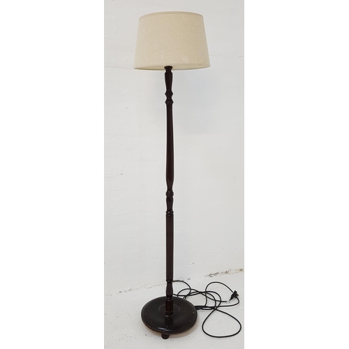 440 - STAINED WOOD STANDARD LAMP
raised on a circular base with a turned column and white hessian shade, 1... 