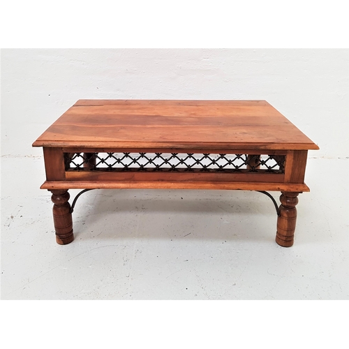 364 - TEAK OCCASIONAL TABLE
with a rectangular moulded top above a lattice work metal frieze, standing on ... 