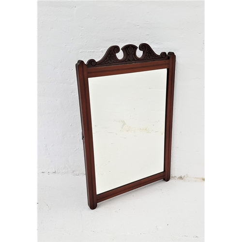 420 - EDWARDIAN MAHOGANY WALL MIRROR
with a carved frame and a bevelled plate, originally from a dressing ... 