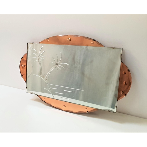487 - ART DECO SHAPED WALL MIRROR
with a central plate decorated with palm trees, set in an oval peach out... 
