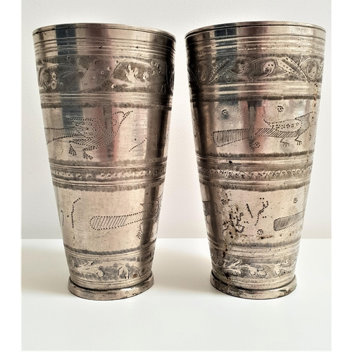 188 - PAIR OF INDIAN WHITE METAL BEAKERS
of tapering form and decorated with panels of birds and foliage, ... 