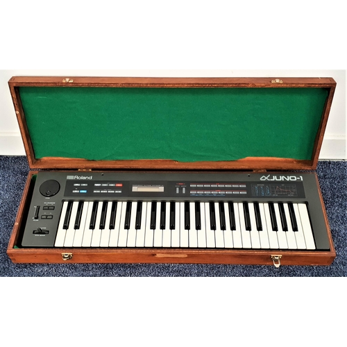 255 - ROLAND JUNO-1 ELECTRONIC SYNTHESIZER
serial number 603476, in a wooden baize lined case