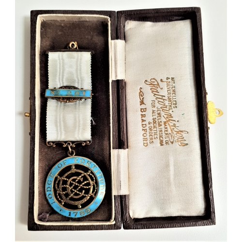 284 - SILVER GILT AND ENAMEL MASONIC MEDAL
with a pale blue water silk ribbon and enamel plaque 'No.281', ... 