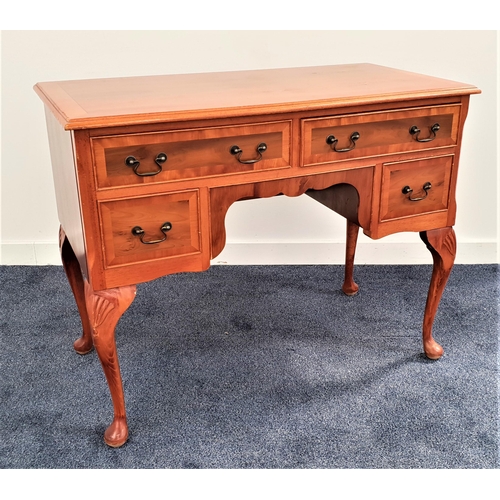 348 - YEW KNEEHOLE DESK
with a moulded top above two long and two short cockbeaded drawers, standing on ca... 