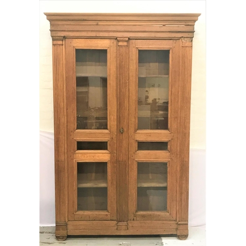 354 - EARLY 19th CENTURY FRENCH PROVINCIAL OAK ARMOIRE
with a moulded pediment above a pair of panelled gl... 