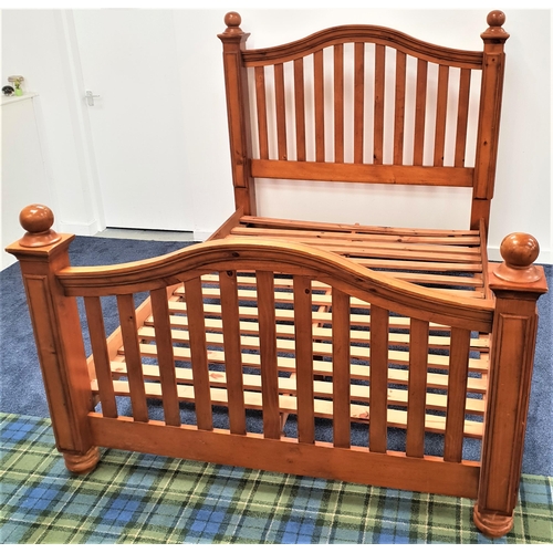 355 - VIETNAMESE TEAK KING SIZE BED
with an arched slatted head and footboard, plank sides and a slatted b... 