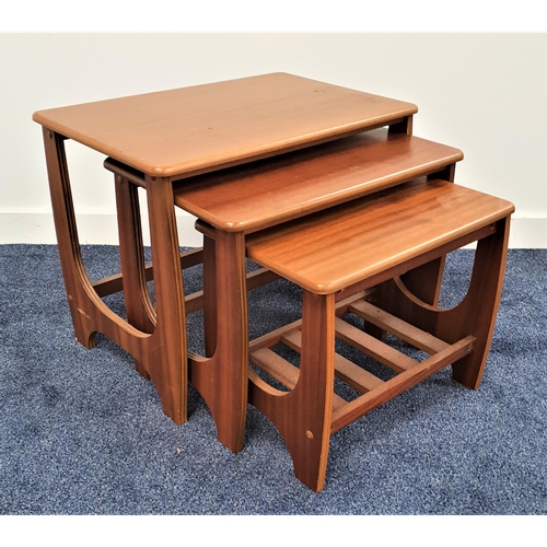 358 - RETRO TEAK NEST OF THREE TABLES
with oblong tops, standing on shaped supports, the smallest table wi... 