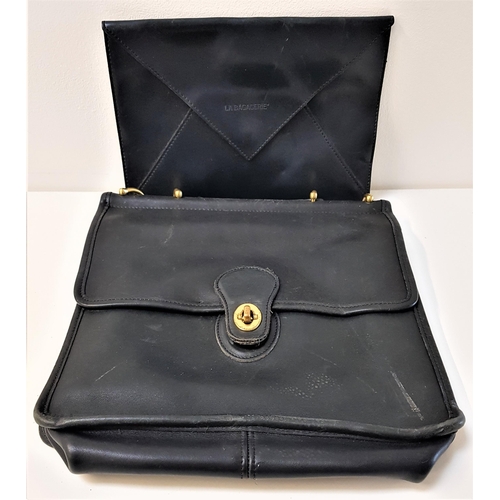 249 - VINTAGE COACH WILLIS HANDBAG
in black leather and numbered H6U-9927, together with a La Bagagerie bl... 