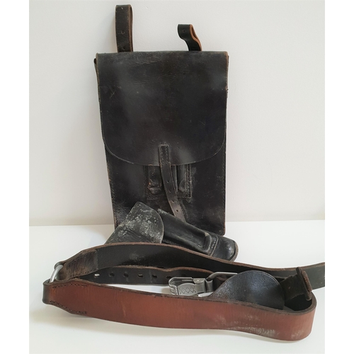 305 - WWII GERMAN PISTOL HOLSTER
in black leather with a belt loop and stamped with the Reichsadler and bd... 