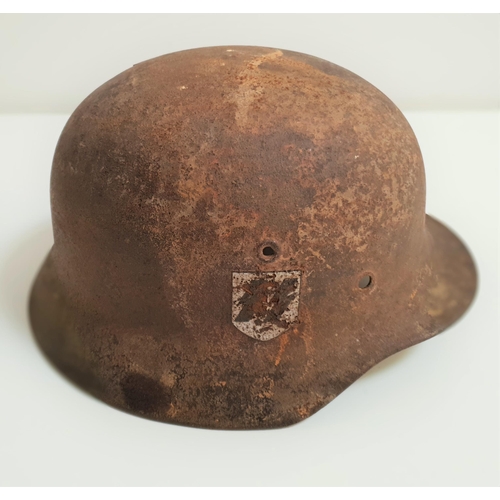 326 - WWII GERMAN M40 HELMET
with SS decal to one side below the ventilation hole, lacking liner and with ... 