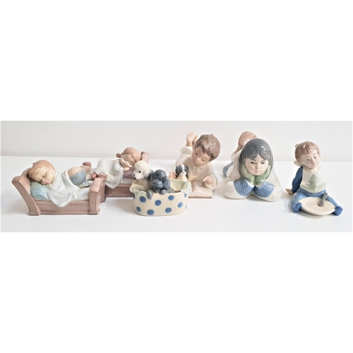 128 - SIX NAO PORCELAIN FIGURES
including a boy with his dog and reading a book, 18cm long, boy with a cle... 