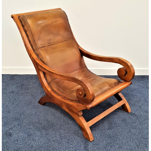 365 - MID 20th CENTURY TEAK ARMCHAIR
with a padded back and seat and elaborate scroll arms, standing on sh... 