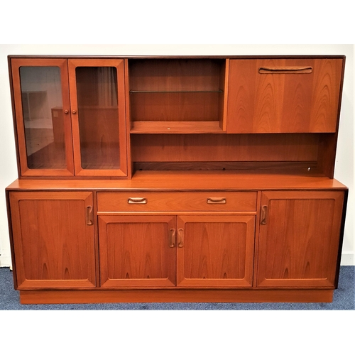 372 - G PLAN TEAK ILLUMINATED SIDEBOARD
the upper section with a pair of glass cupboard doors opening to r... 