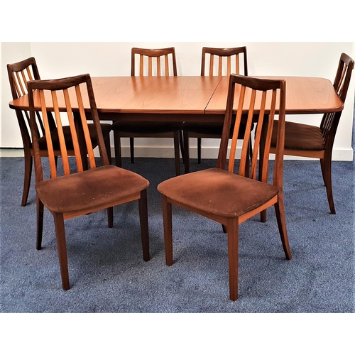 373 - G PLAN TEAK DINING SUITE
comprising a table with a pull apart top top and fold out leaf, standing on... 