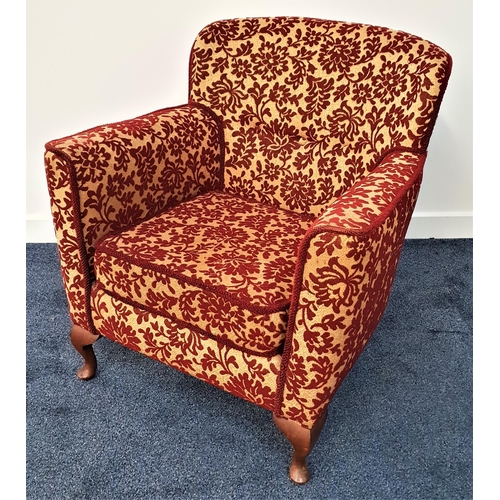 374 - 1950s ARMCHAIR
with a shaped button back and padded arms above a seat cushion, standing on stout cab... 