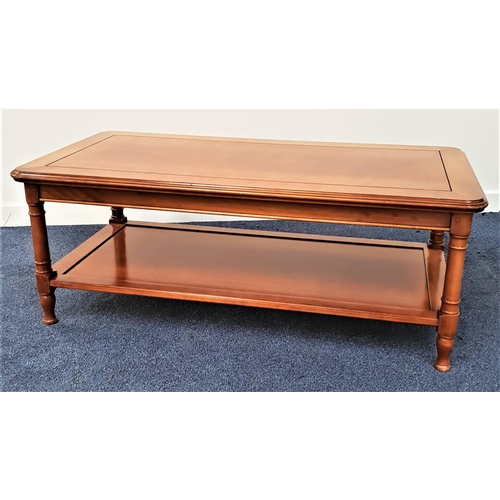 376 - GRANGE CHERRY OCCASIONAL TABLE
with a rectangular top standing on turned supports united by an under... 