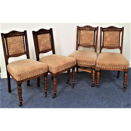 378 - SET OF FOUR EDWARDIAN OAK DINING CHAIRS
with shaped carved top rails above padded backs with decorat... 