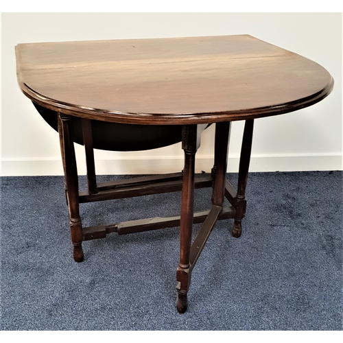 380 - OAK GATE LEG DINING TABLE
with shaped drop flaps, standing on turned supports, 91.5cm wide