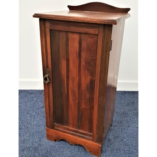 382 - EDWARDIAN MAHOGANY POT CUPBOARD
with a shaped and raised back above a moulded top, with a panelled d... 