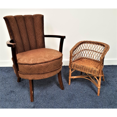 385 - 1950s ARMCHAIR
with a padded ribbed back above a circular padded seat, standing on turned supports, ... 