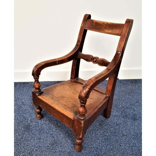 388 - CHILD'S OAK OPEN ARMCHAIR
with a solid seat and turned front supports