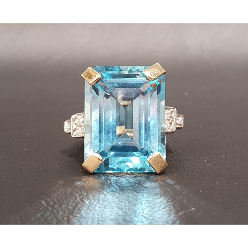 70 - BLUE TOPAZ AND DIAMOND COCKTAIL RING
the large emerald cut blue topaz measuring approximately 19.5mm...