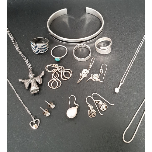 9 - SELECTION OF SILVER JEWELLERY
including four rings, pendants on chains, a black enamel set bangle, f... 