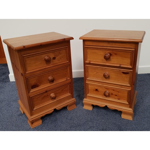 392 - PAIR OF WAXED PINE BEDSIDE CHESTS
with a moulded top above three panelled drawers, standing on brack... 