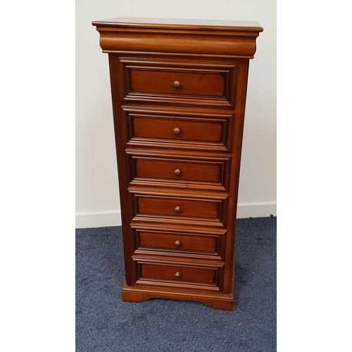 394 - NARROW CHERRY CHEST OF DRAWERS
with a moulded top above a cushion frieze drawer and six panelled dra... 