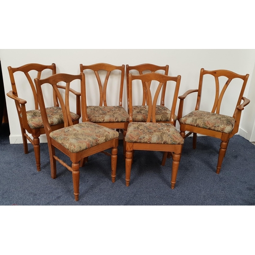 395 - SET OF DUCAL OAK DINING CHAIRS
comprising four single and two carvers with shaped top rails above a ... 